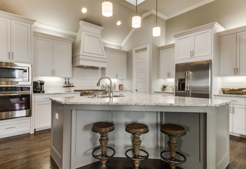 Interior of luxurious kitchen in a Canals at Grand Park model home by Cambridge Homes in Frisco, Texas
