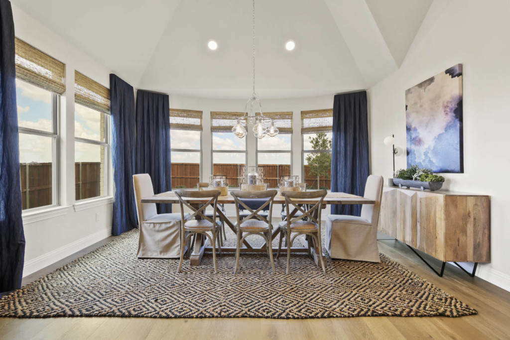 Interior of dining room with vaulted ceiling in a model home by Cambridge Homes in the Prairie View community in Frisco, Texas